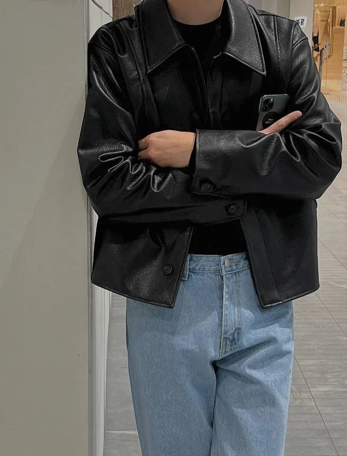 Back angle of the Suspended Clothing jacket, showing the wide shoulders of this men cropped faux leather jacket