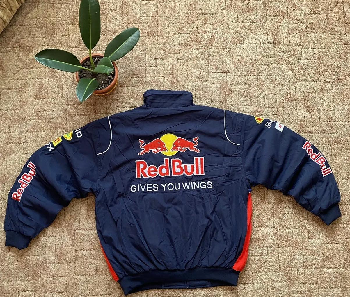 Back view of navy classic motorsport jacket with large embroidered Red Bull logo and sponsor patches