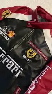 Black and maroon racing jacket with high-definition embroidered Ferrari, Shell, and Bridgestone patches.