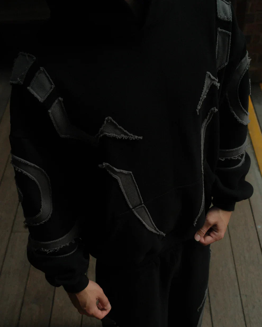 Close up of raw edge frayed tattoo design on premium Jujutsu Kaisen anime hoodie