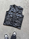 Front layout of the Suspended Clothing black utility vest, a heavy-duty black faux leather utility vest for streetwear