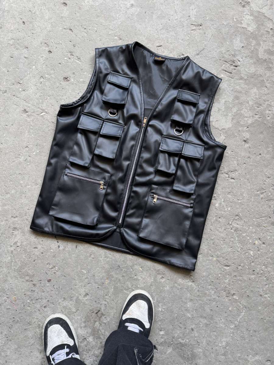 Front layout of the Suspended Clothing black utility vest, a heavy-duty black faux leather utility vest for streetwear
