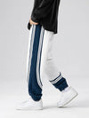 Dual-tone retro striped joggers in navy and white, streetwear fashion pants