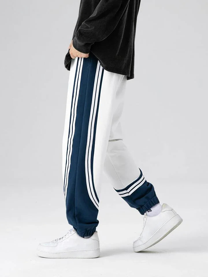 Dual-tone retro striped joggers in navy and white, streetwear fashion pants