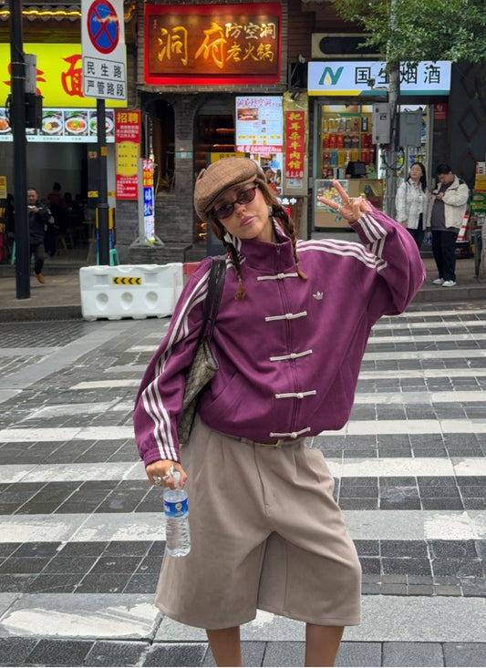 Front view of Suspended Clothing CNY jacket showing the oversized wine purple bomber design