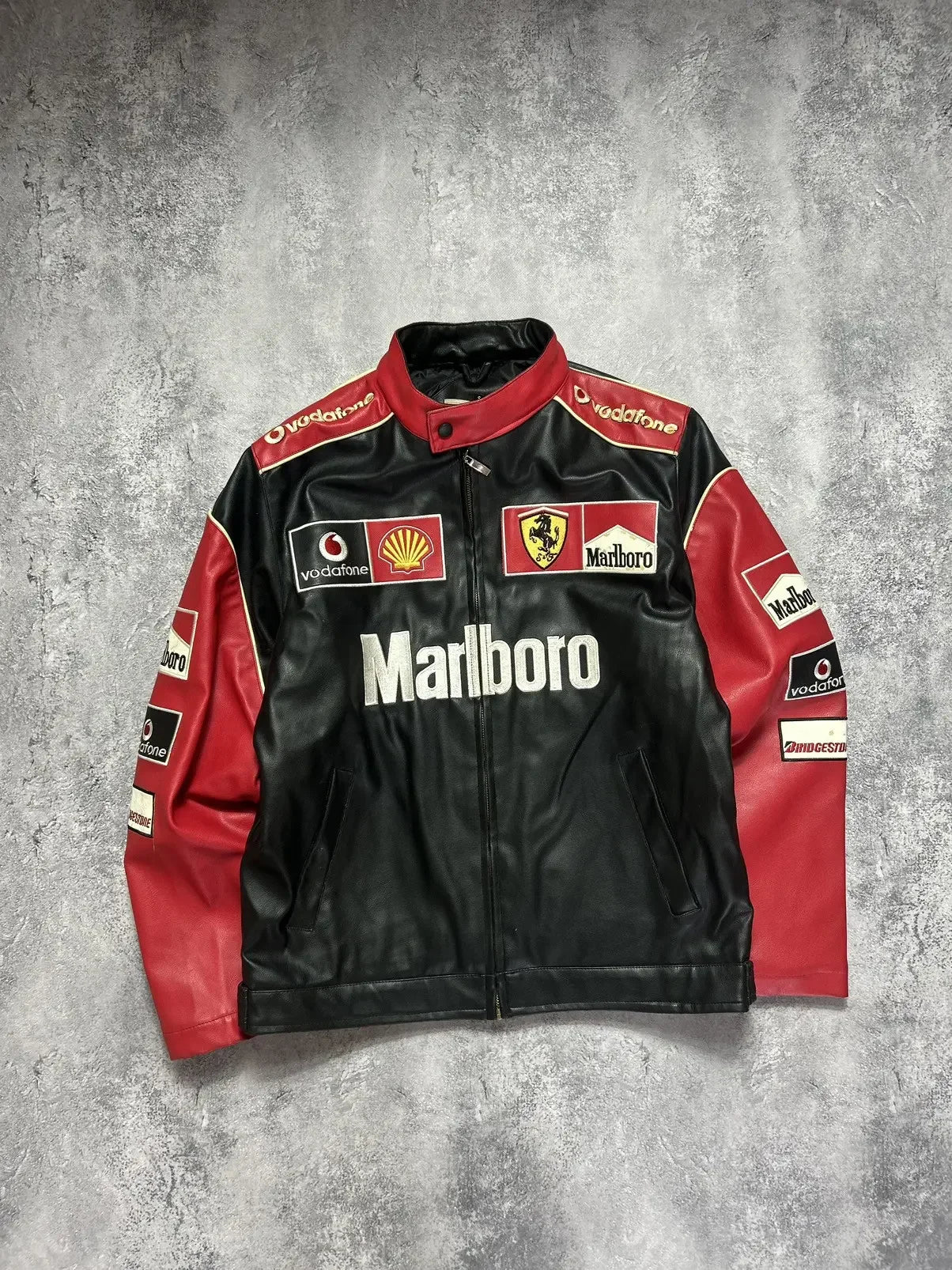 Black and red vintage racing jacket with embroidered motorsport patches and sponsor logos