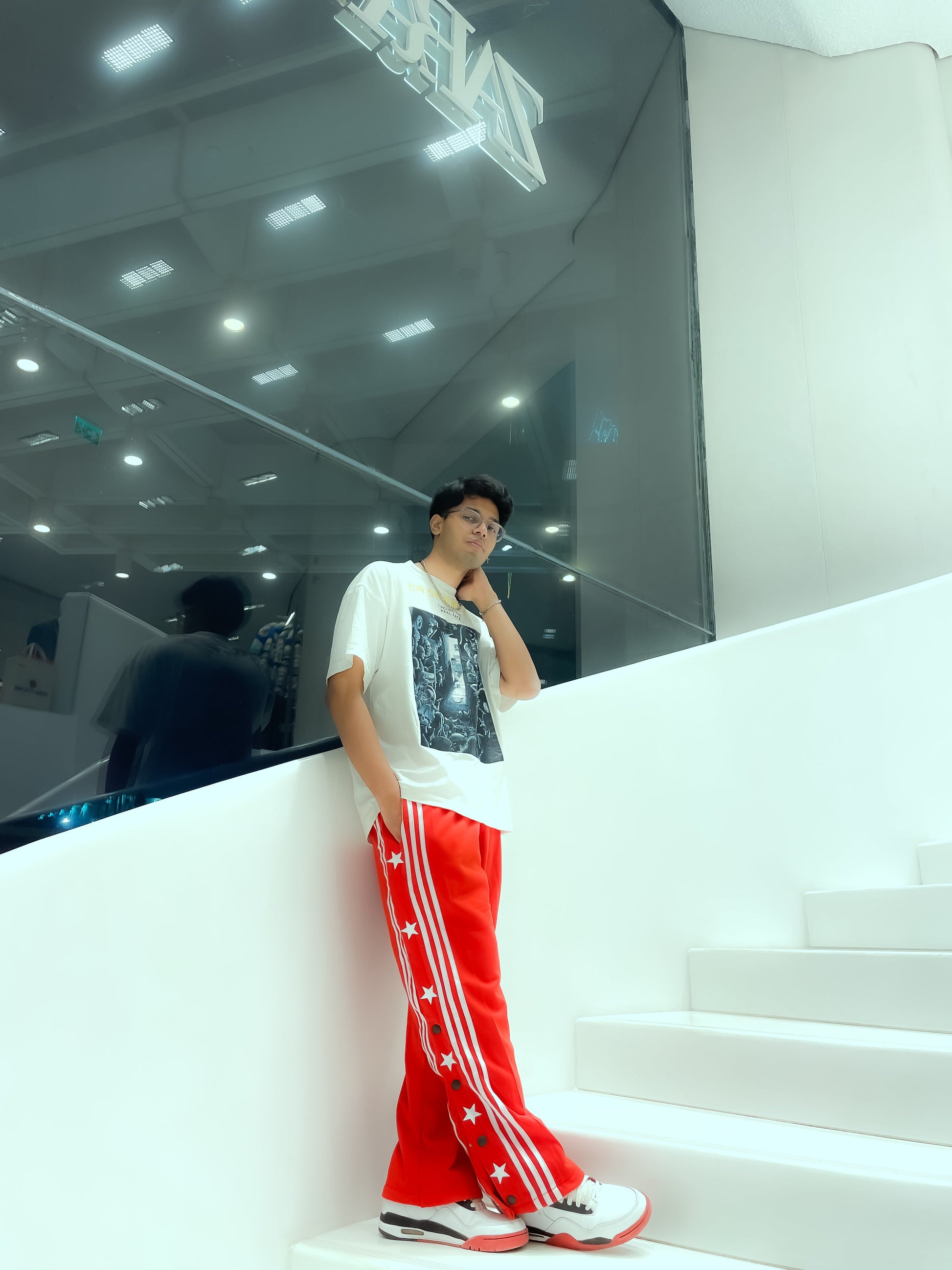 Lifestyle shot of a person walking, showcasing the movement and tech-twill drape of Suspended Clothing 90s style breakaway pants.