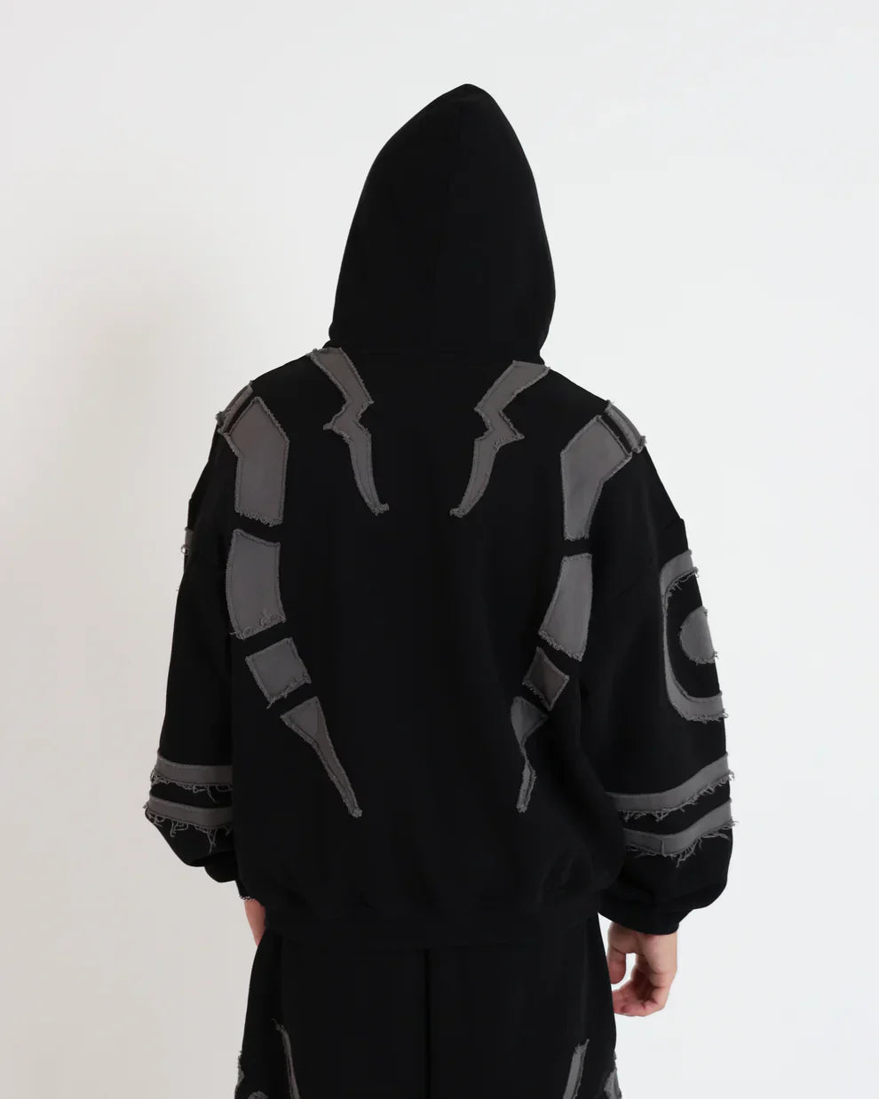 Men styling Suspended Clothing Ryomen Sukuna black oversized hoodie with dark streetwear aesthetic