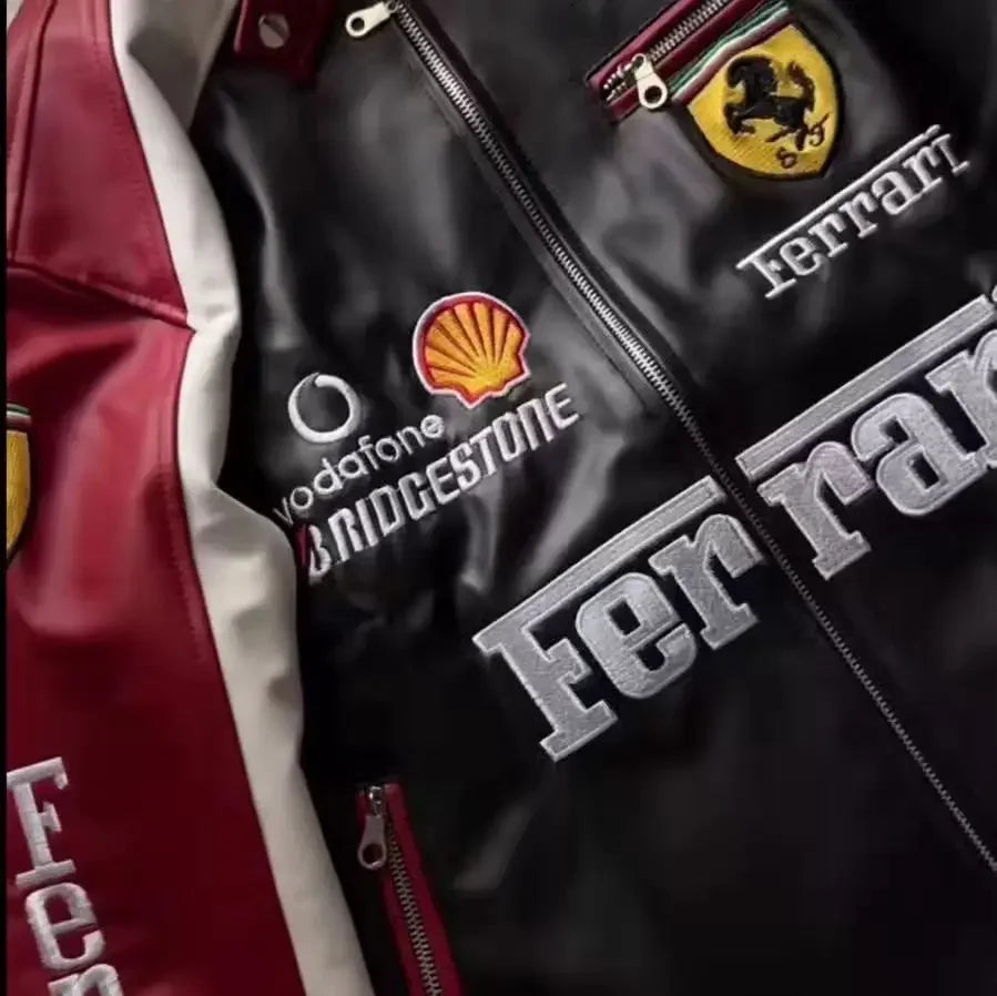 Close-up of premium leather jacket with embroidered racing patches and high-quality zipper.