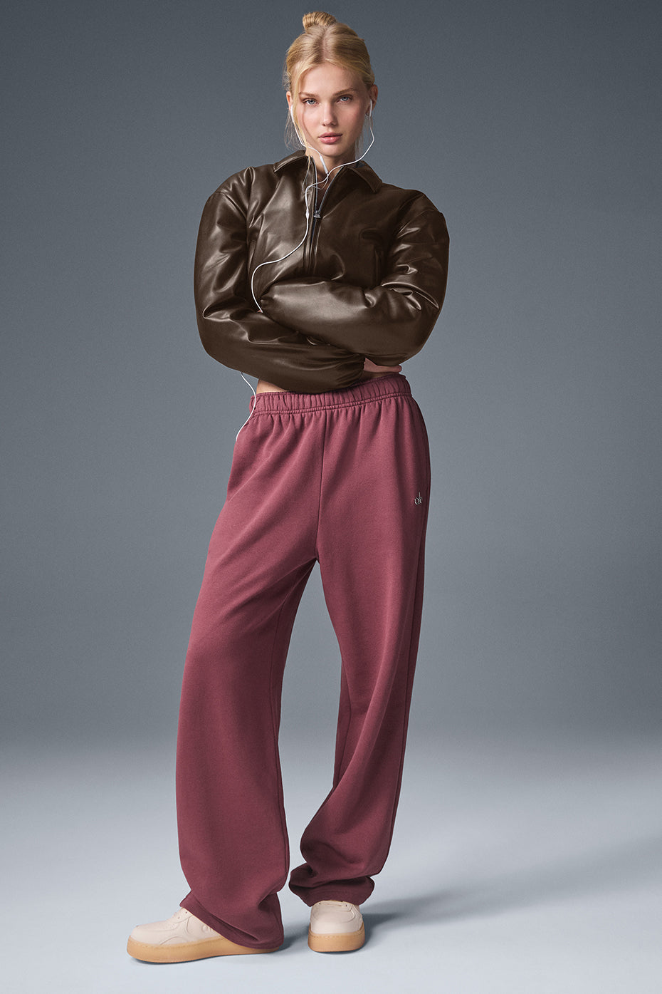 Side angle of Suspended Clothing brown cropped leather jacket showing the oversized boxy fit