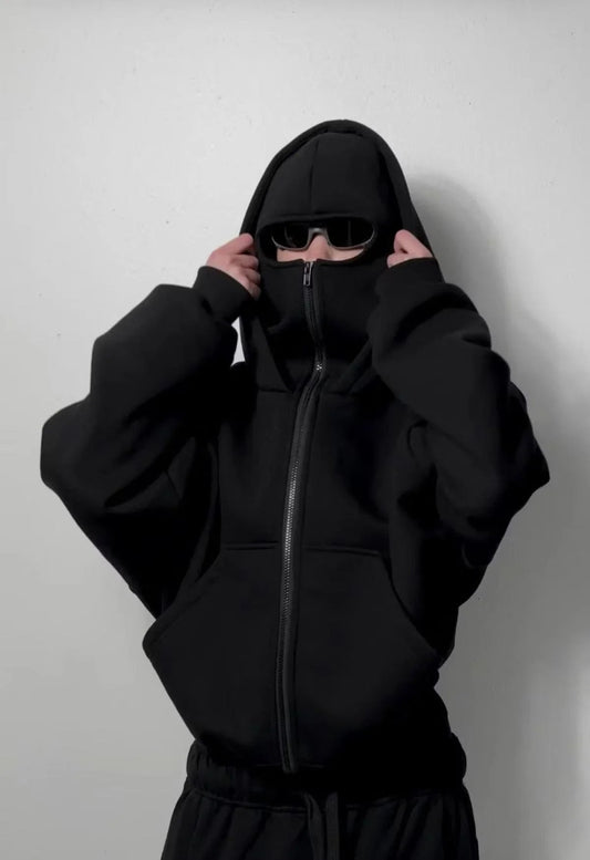 Urban streetwear oversized black hoodie with front zip, face covering, and sunglasses