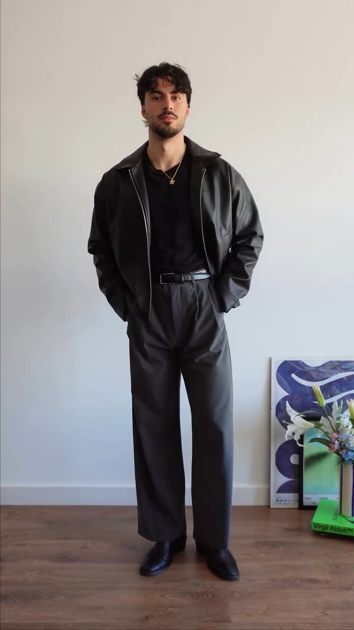 Suspended Clothing black faux leather jacket, featuring the best black vegan leather jacket for streetwear aesthetic.