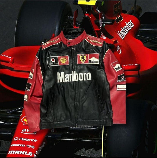 Black and red Ferrari racing jacket with sponsor logos in front of a red formula car