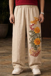 Chinese baggy pants for unisex with yellow peony 3D embroidery on beige fabric by Suspended Clothing.