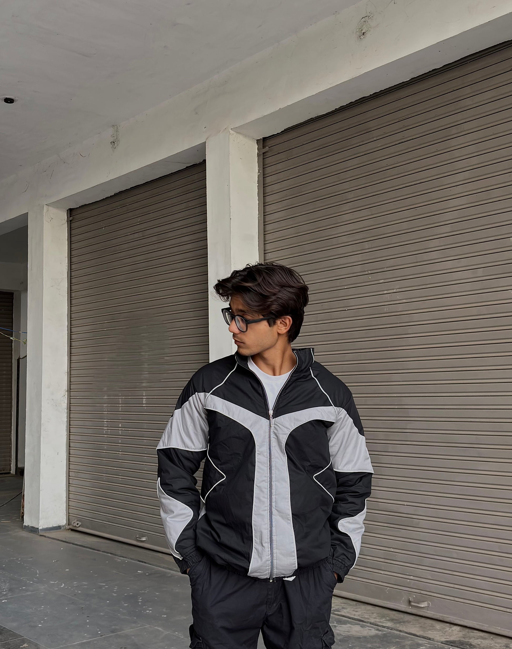 the Suspended Clothing reflective parachute summer jacket showing the oversized streetwear fit.