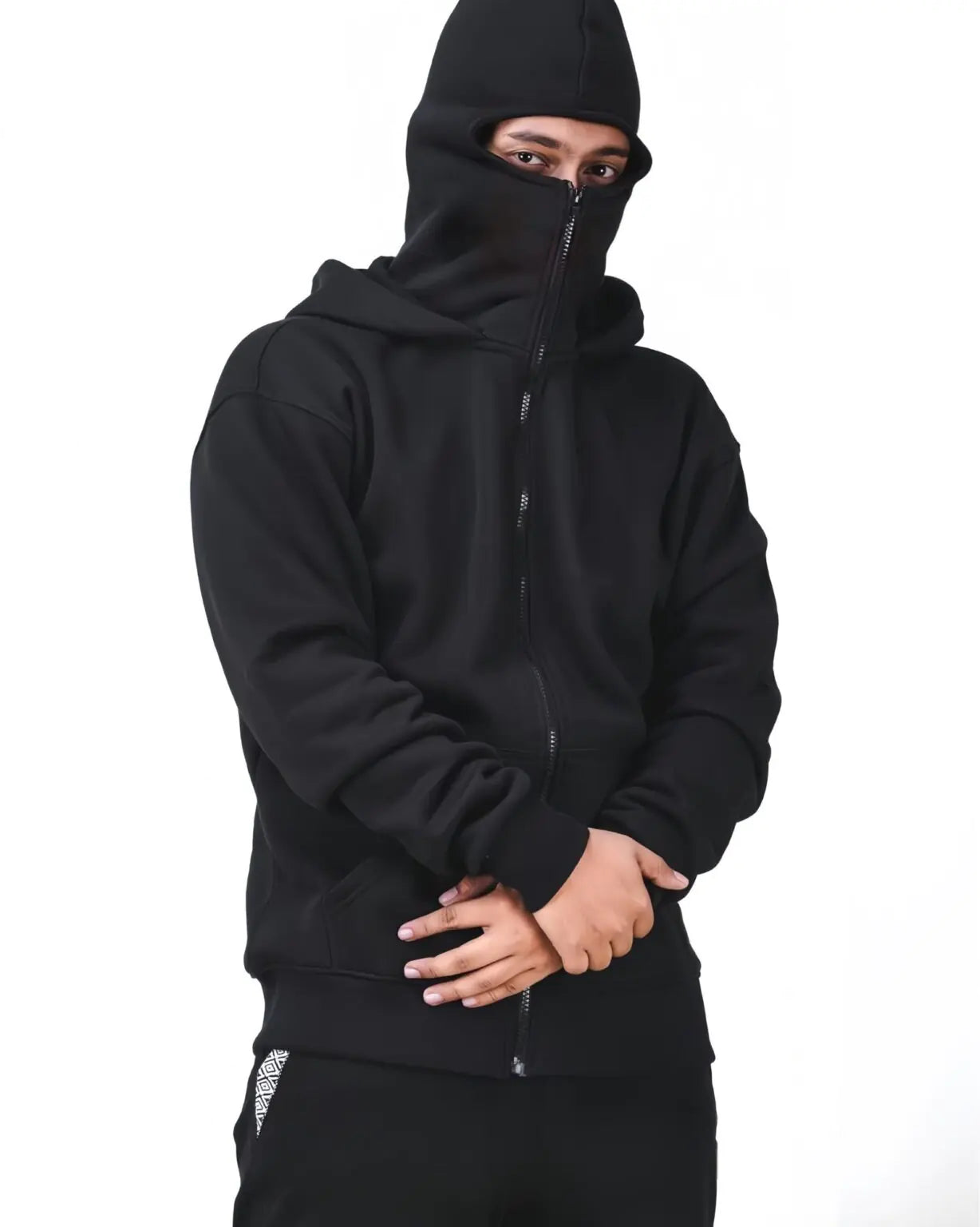Close-up of Suspended Clothing integrated facial coverage sitting flush against the collar for a minimalist subterranean streetwear look.