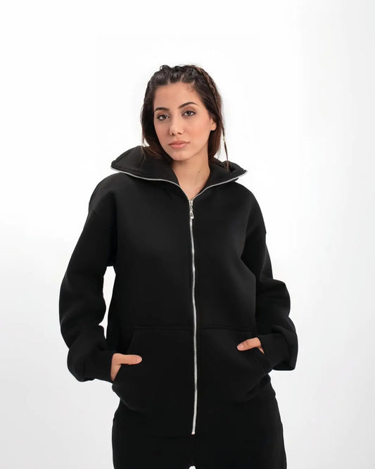 Model wearing Suspended Clothing achromatic black balaclava hoodie demonstrating anatomical stealth for cyber-goth techwear aesthetic.